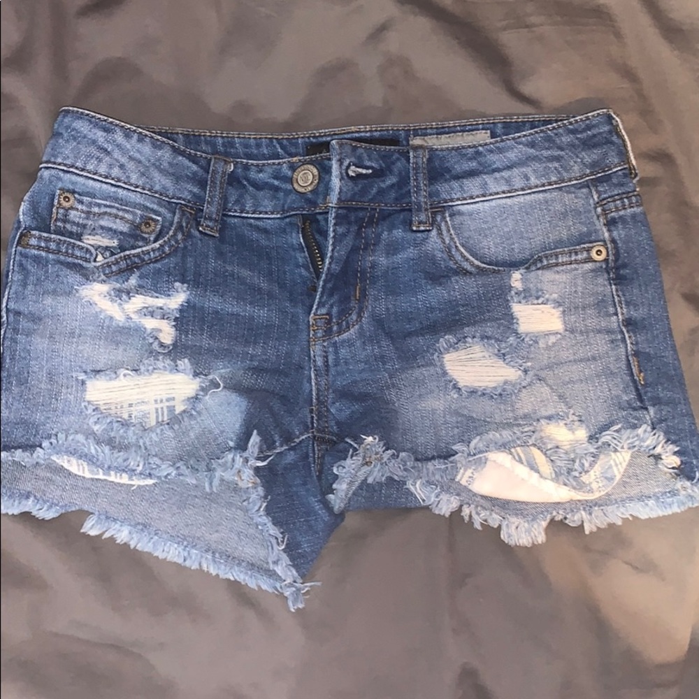 Medium wash ripped jean shorts